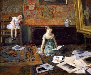 Two young girls watching paintings